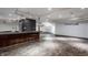 Basement bar with a granite countertop and wood cabinets at 11091 Crooked Stick Ln, Carmel, IN 46032