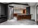 Modern basement kitchen with granite countertops and stainless steel appliances at 11091 Crooked Stick Ln, Carmel, IN 46032
