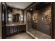Modern bathroom featuring a large walk-in shower and dark brown vanity at 11091 Crooked Stick Ln, Carmel, IN 46032