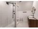 Modern bathroom with a walk-in shower, floating vanity, and concrete flooring at 11091 Crooked Stick Ln, Carmel, IN 46032