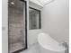 Modern bathroom with freestanding tub and marble shower at 11091 Crooked Stick Ln, Carmel, IN 46032