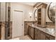 Bathroom with double vanity, glass vessel sinks, and tiled shower at 11091 Crooked Stick Ln, Carmel, IN 46032