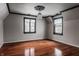 Bright bedroom with hardwood floors, neutral walls and two windows at 11091 Crooked Stick Ln, Carmel, IN 46032