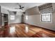 Bedroom with hardwood floors, neutral walls, and ceiling fan at 11091 Crooked Stick Ln, Carmel, IN 46032