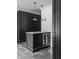 Butler's pantry with dark cabinetry, quartz countertops, and beverage cooler at 11091 Crooked Stick Ln, Carmel, IN 46032