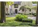 Inviting front entrance with stone walkway and lush greenery at 11091 Crooked Stick Ln, Carmel, IN 46032