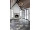 Gathering room features a fireplace, vaulted ceiling, and dark hardwood floors at 11091 Crooked Stick Ln, Carmel, IN 46032