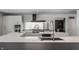 Modern kitchen with large island, stainless steel appliances, and dark countertops at 11091 Crooked Stick Ln, Carmel, IN 46032