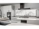 Modern kitchen with stainless steel appliances and ample counter space at 11091 Crooked Stick Ln, Carmel, IN 46032