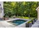 Private, rectangular pool with flagstone patio and planters at 11091 Crooked Stick Ln, Carmel, IN 46032