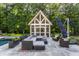 Relaxing patio area with sectional seating and a modern pool at 11091 Crooked Stick Ln, Carmel, IN 46032