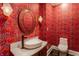 Stylish powder room with bold floral wallpaper and modern vanity at 11091 Crooked Stick Ln, Carmel, IN 46032