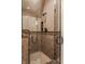 Large tiled shower with glass enclosure and multiple shower heads at 11091 Crooked Stick Ln, Carmel, IN 46032