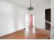 Empty dining room with hardwood floors and chandelier, showing stairs at 1419 Lexington Ave, Indianapolis, IN 46203