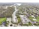 Aerial view showcasing a residential neighborhood near a river and boat docks at 14990 E 104Th St, Fishers, IN 46040