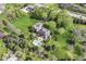 Stunning aerial shot of grand estate featuring pool, immaculate lawns, and lush landscaping at 14990 E 104Th St, Fishers, IN 46040