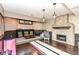 Finished basement features a stone fireplace, dark wood floors and custom storage shelves at 14990 E 104Th St, Fishers, IN 46040