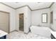 Luxurious bathroom with a modern tub, glass enclosed shower, and marble-look flooring at 14990 E 104Th St, Fishers, IN 46040