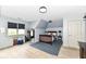 Light-filled bedroom with hardwood floors, desk, and comfortable furnishings at 14990 E 104Th St, Fishers, IN 46040