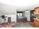 Cozy bedroom features a built-in bed with storage underneath, brick floors, and gray paint at 14990 E 104Th St, Fishers, IN 46040