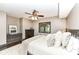 Comfortable bedroom with decorative pillows, ceiling fan, and a window with checkered curtains at 14990 E 104Th St, Fishers, IN 46040