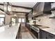 Gourmet kitchen features stainless steel appliances, marble countertops and backsplash, plus elegant lighting at 14990 E 104Th St, Fishers, IN 46040