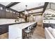 Beautiful kitchen with a large island, marble countertops, stainless steel appliances, and wooden beam accents at 14990 E 104Th St, Fishers, IN 46040