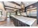 Stunning kitchen with a large island, marble countertops, stainless steel appliances, and stylish pendant lighting at 14990 E 104Th St, Fishers, IN 46040