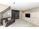 Cozy living room with a statement chalkboard wall, plush armchair, and modern geometric rug at 14990 E 104Th St, Fishers, IN 46040