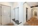 Mudroom with built-in storage and seating featuring dark wood trim at 14990 E 104Th St, Fishers, IN 46040