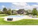 Relaxing in-ground pool with sun loungers, surrounded by lush greenery and backyard views at 14990 E 104Th St, Fishers, IN 46040