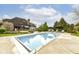 Backyard pool offers a peaceful retreat with ample seating and manicured landscaping at 14990 E 104Th St, Fishers, IN 46040