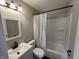 Updated bathroom featuring a modern sink, vanity, and shower with tile surround at 1612 E Raymond St, Indianapolis, IN 46203
