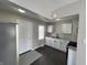 Modern kitchen featuring stainless steel appliances, white cabinets, and a stylish floor at 1612 E Raymond St, Indianapolis, IN 46203
