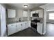 Beautiful kitchen featuring stainless steel appliances, granite countertops, and modern cabinetry at 1612 E Raymond St, Indianapolis, IN 46203
