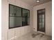 Covered back patio with large windows and a dark brown French door at 17363 Newton Main St, Westfield, IN 46074