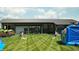 Community lawn area with cornhole and bounce house at 17363 Newton Main St, Westfield, IN 46074