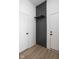 Clean entryway with dark gray shiplap accent wall and floating shelf at 17363 Newton Main St, Westfield, IN 46074