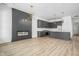 Modern kitchen with gray cabinetry, quartz countertops, and a built-in fireplace at 17363 Newton Main St, Westfield, IN 46074