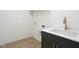Modern laundry room with a quartz countertop, sink, and stylish gold faucet at 17363 Newton Main St, Westfield, IN 46074