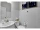 Clean powder room with white subway tiles and pedestal sink at 3050 Vista View Dr, Greenwood, IN 46143