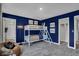 bedroom with built-in bunk bed, a beanbag chair, and car themed artwork at 3050 Vista View Dr, Greenwood, IN 46143