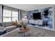 Bright bonus room with water views, comfy seating and large TV at 3050 Vista View Dr, Greenwood, IN 46143