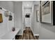 Bright hallway with bench, powder room, and hardwood floors at 3050 Vista View Dr, Greenwood, IN 46143