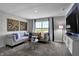 Spacious living area with sectional sofa, large window, and built-in entertainment center at 3050 Vista View Dr, Greenwood, IN 46143
