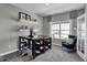 Study with large window, built-in shelving, and a comfortable chair at 3050 Vista View Dr, Greenwood, IN 46143