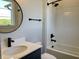 Modern bathroom featuring subway tile in shower and black fixtures and vanity at 373 S Cherry St, Westfield, IN 46074