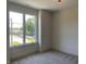 Bright bedroom with large window, neutral walls, and plush gray carpet at 373 S Cherry St, Westfield, IN 46074