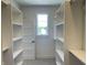 Walk-in closet with built-in shelving and natural light at 373 S Cherry St, Westfield, IN 46074