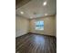 Bright dining room featuring wood-look flooring, modern lighting, and a large window at 373 S Cherry St, Westfield, IN 46074